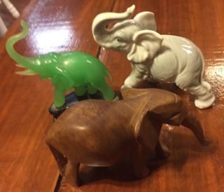 Three SMALL ELEPHANTS FIGURINES.  Wood,  Porcelain,  And Green Jade On Base 3