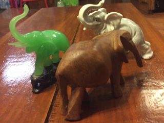 Three SMALL ELEPHANTS FIGURINES.  Wood,  Porcelain,  And Green Jade On Base 4
