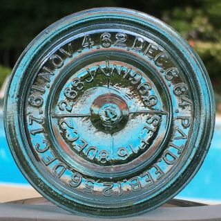 Aqua Glass Midget Pint Canning Fruit Jar Lid Embossed With Several Patent Dates.