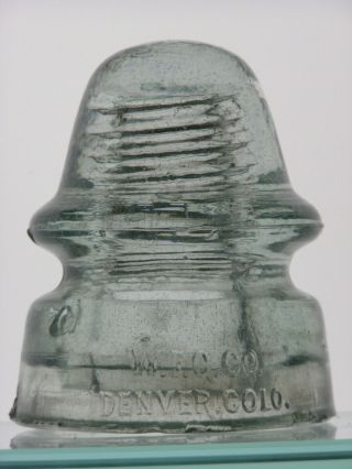 Cd 162 [10] W.  F.  G.  Co.  Denver,  Colo.  Ice Colored Glass Insulator Oblong Base