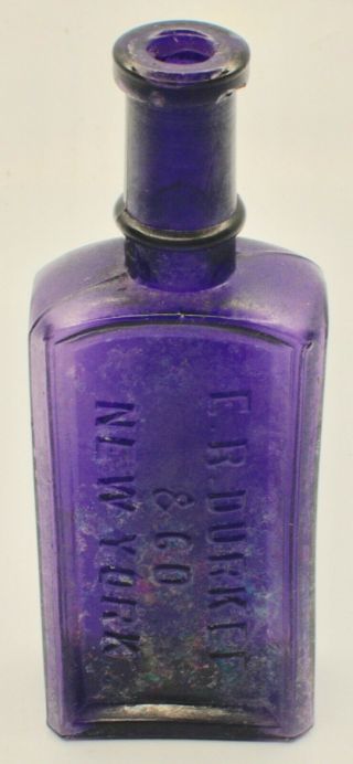 E.  R.  Durkee & Co.  Purple Glass Extract Bottle With Patina/opalescence
