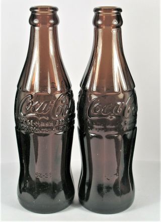 Vintage Dark Amber Glass Coca Cola Bottles.  2 - 6 1/2 Oz.