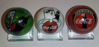 Set Of 3 Coca Cola 2 Collectible Glass 1 " Logo Marbles With Stands