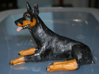 Doberman Pinscher Collectible Figurine Statue Laying Down With Tongue Out