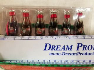 Six Evolution of Santa Coca Cola Bottle Ornaments 1931 - 1936 set 1 2
