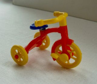 Vintage Renwal hard plastic No 7 tricycle made in US bright red,  yellow & blue 2