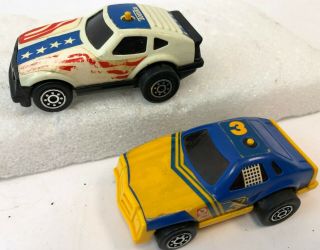 Vintage Pair Tonka Japan Red White Blue Yellow Button Friction Toy Race Cars
