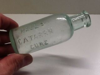 Antique Aqua Halls Catarrh Cure Bottle.