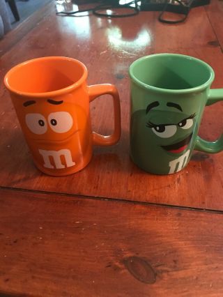 M&m Coffee Mug Set Of 2 Orange And Green Great Shape