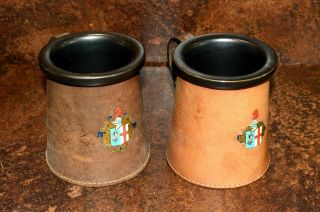 Two Leather Hide Tankards With Ceramic Inserts