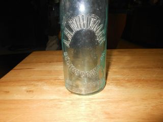 Old Blob Top Bottle From A.  H.  Whitmer Of Selinsgrove Pa With A Porcelain Topper