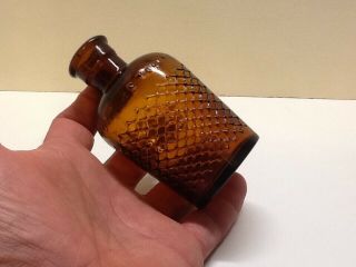 Small Amber Not To Be Taken Cross Hatch Poison Bottle.