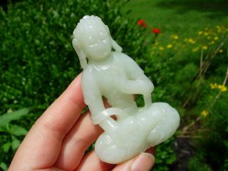 A Chinese Carved Light Celadon Jade Figure Of Seated Buddha