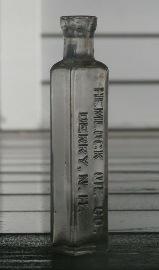 Hemlock Oil Co.  - Derry,  N.  H.  Four Sided Blown Antique Bottle,  1800 