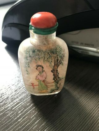 AN INSIDE - PAINTED CRYSTAL SNUFF BOTTLE.  WITH CORAL TOP. 2