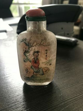 AN INSIDE - PAINTED CRYSTAL SNUFF BOTTLE.  WITH CORAL TOP. 6