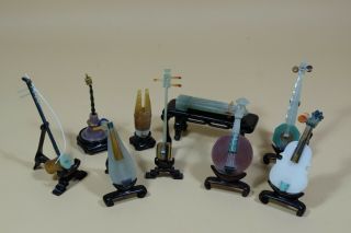9 Chinese Jade & Hardstone Musical Instruments With Wooden Stands & Case