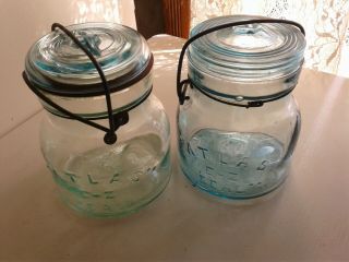 2 " Atlas " E - Z Sealsquat Quarts With Wire Bail & Glass Lids,  One Is Blue The Othe