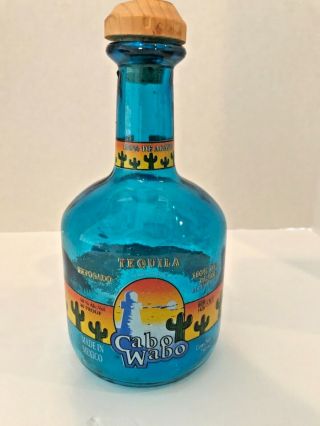 Cabo Wabo Tequilla Bottle.  Blue Glass.  Empty