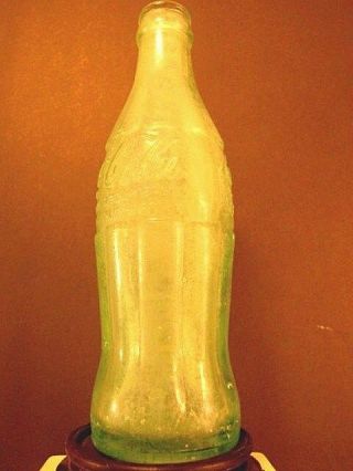 2 very old Coca - Cola Bottles,  Green one from Rocky Ford,  Co 4
