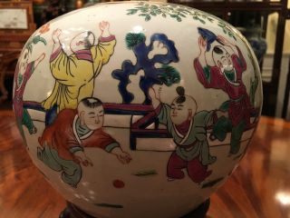 An Chinese Antique Famille Rose Porcelain Jar with Wooden Stand. 2