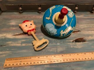 Vintage toy top and 1975 Warner Brothers,  Inc.  Porky Pig rattle. 2