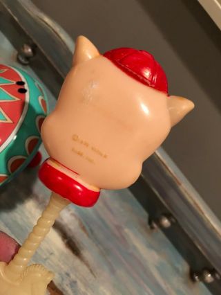 Vintage toy top and 1975 Warner Brothers,  Inc.  Porky Pig rattle. 5