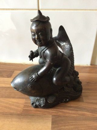 Chinese Bronze Figurine Of A Man Riding A Fish