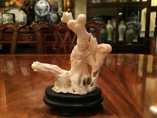 A Chinese Antique Carved White Coral Guanyin With Wooden Stand.