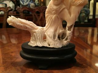 A Chinese Antique Carved White Coral Guanyin with Wooden Stand. 2