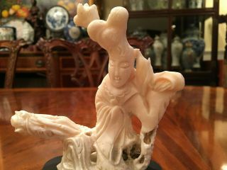 A Chinese Antique Carved White Coral Guanyin with Wooden Stand. 3