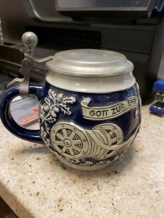 german stein of firemen with hose and looks like a house fire.  coolectibles. 3