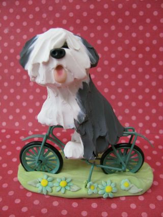 Handsculpted Old English Sheepdog Bicycle Ride Figurine
