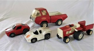 Vintage 1970s Tonka Pressed Metal Truck,  Tractor With Trailer,  And Two Race Cars