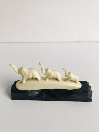 Miniature Hand Carved Ivory Colored Marching Elephants Figurine On Wood Base