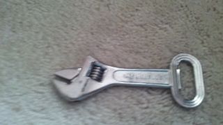 Small Wrench With Bottle Opener On End.  5 1/2 Inches Long Total.
