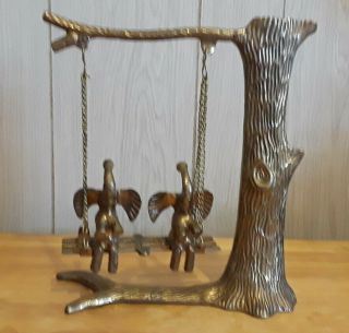 Vintage Brass Elephants Sitting On A Swing,  Hanging From A Tree.