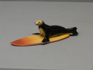 Cool Northern Rose Sea Lion Lying On Surfboard