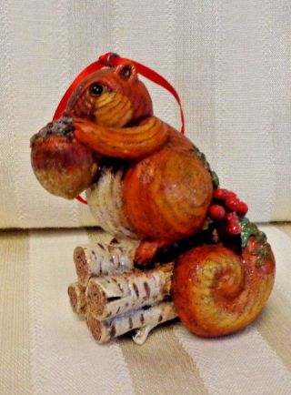 Squirrel With Acorn On Logs Christmas Ornament