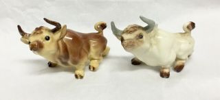 2 Different Vintage Hagen Renaker Miniature Cartoony Bulls - White & Red Brown