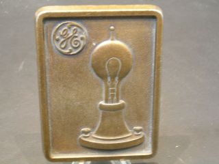 Vintage G.  E.  Brass Paperweight With Edison Bulb And G.  E.  Logo