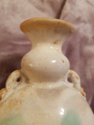 CHINESE EARLY MING CREAM AND GREEN DOUBLE HANDLE VASE.  FOR AGE 2