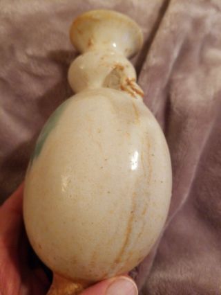 CHINESE EARLY MING CREAM AND GREEN DOUBLE HANDLE VASE.  FOR AGE 6