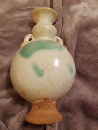 CHINESE EARLY MING CREAM AND GREEN DOUBLE HANDLE VASE.  FOR AGE 8