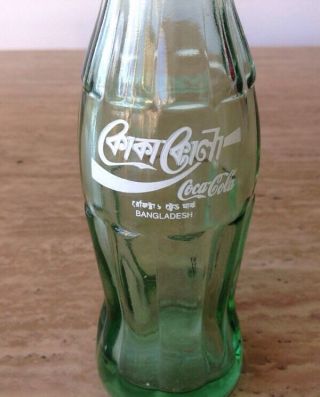 6.  5 OZ.  GREEN GLASS COCA - COLA BOTTLE BANGLADESH INTERNATIONAL COKE BOTTLE 4
