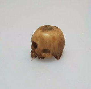 A lovely 19th century Meiji period Ojime of a skull. 2