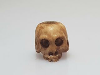 A lovely 19th century Meiji period Ojime of a skull. 6