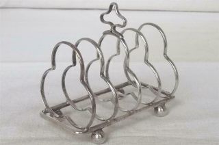 A Antique Solid Sterling Silver Shaped Toast Rack Birmingham 1912.