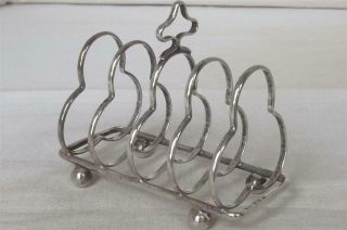 A ANTIQUE SOLID STERLING SILVER SHAPED TOAST RACK BIRMINGHAM 1912. 2