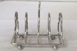 A ANTIQUE SOLID STERLING SILVER SHAPED TOAST RACK BIRMINGHAM 1912. 3